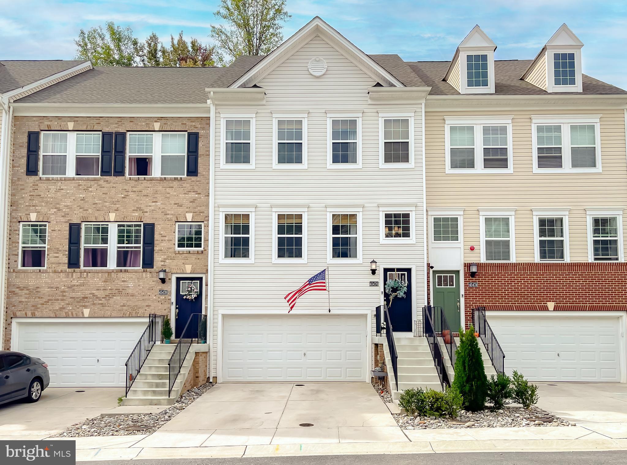 a front view of a house with a view of building