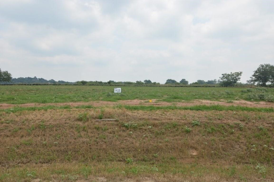 a view of a field with cabinets