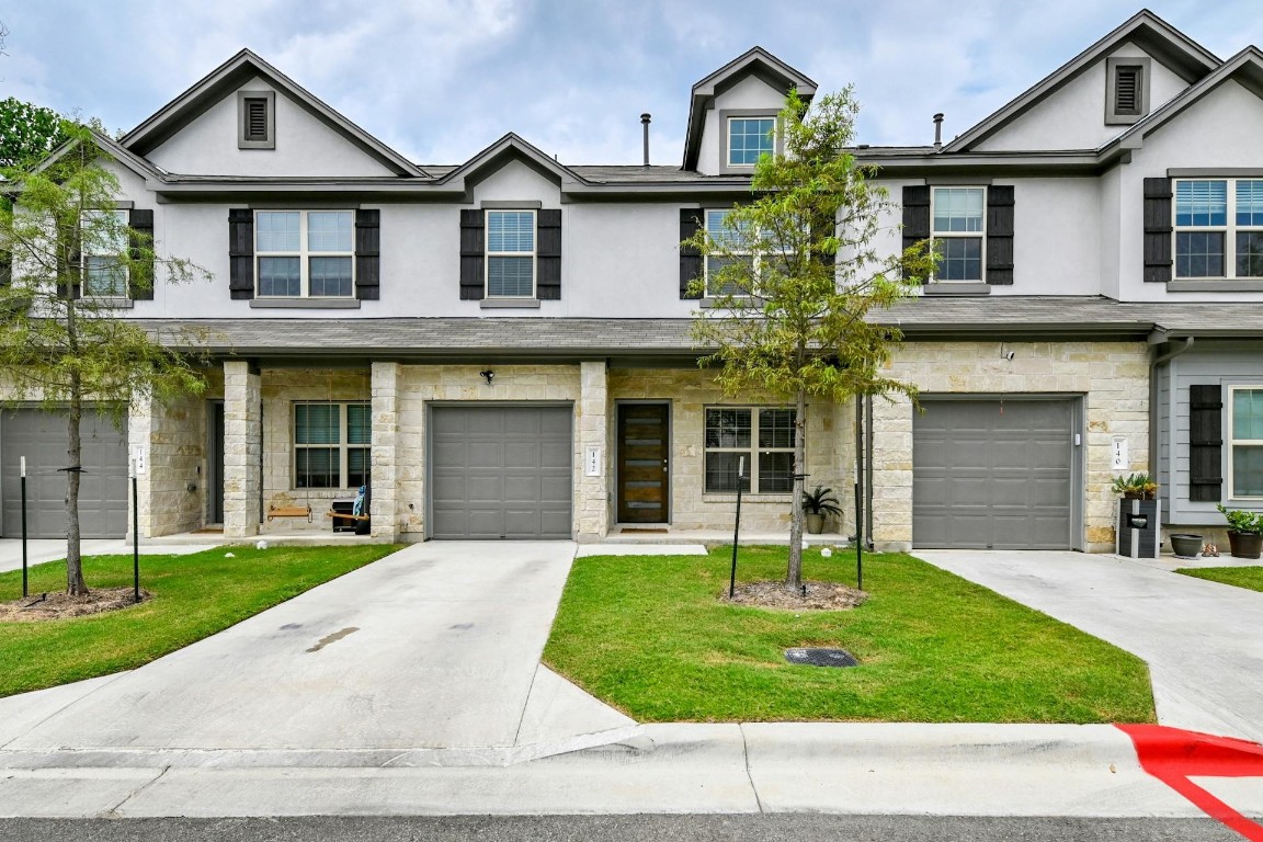 front view of a house with a yard