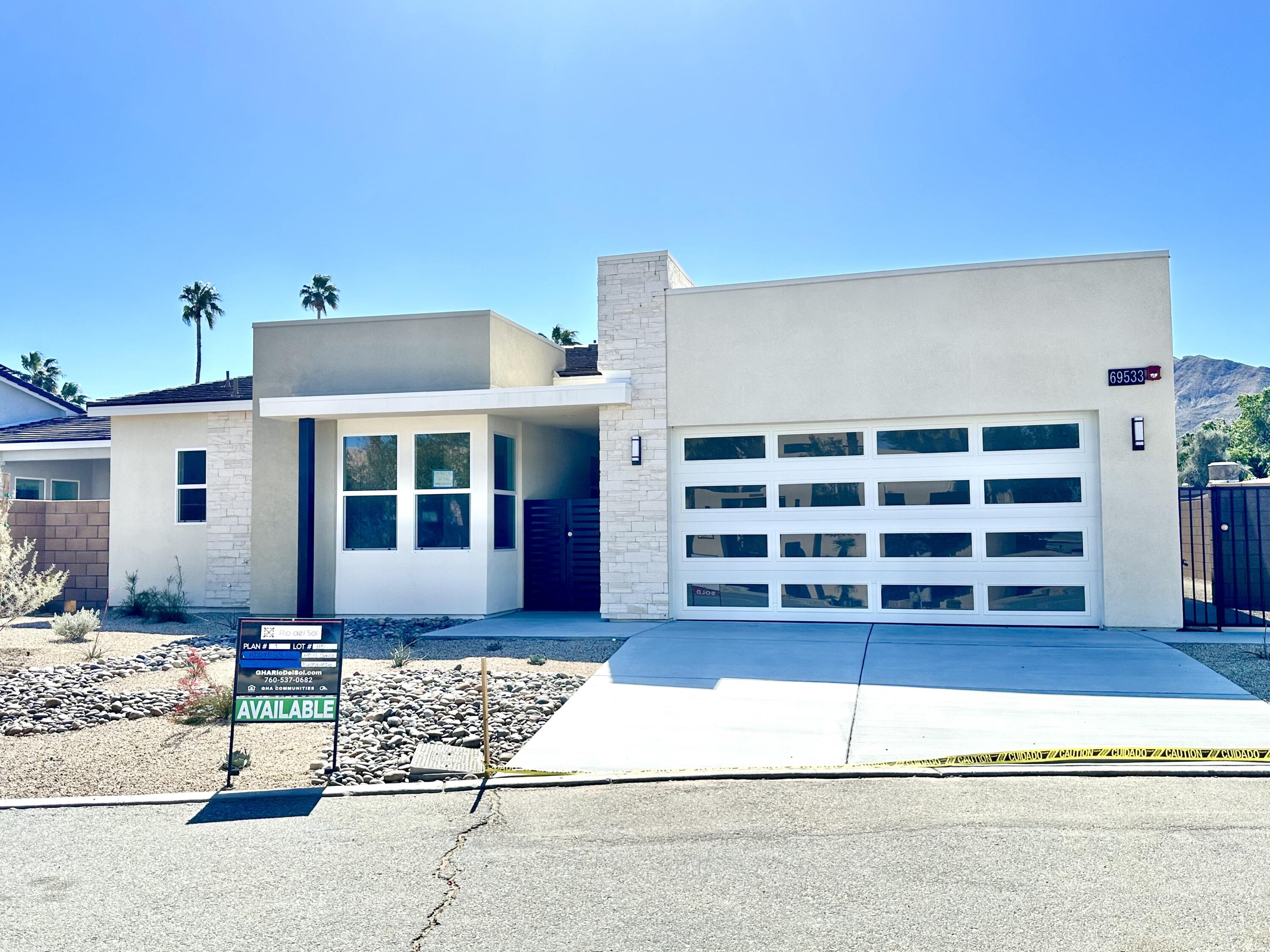 a front view of a house with a garage