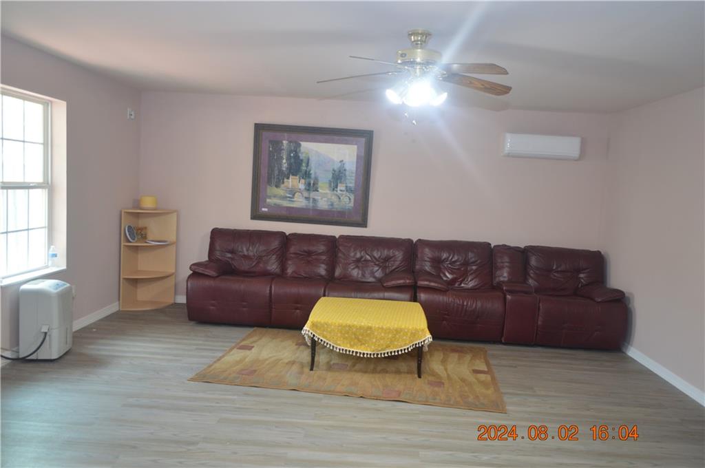 a living room with a couch and a chandelier