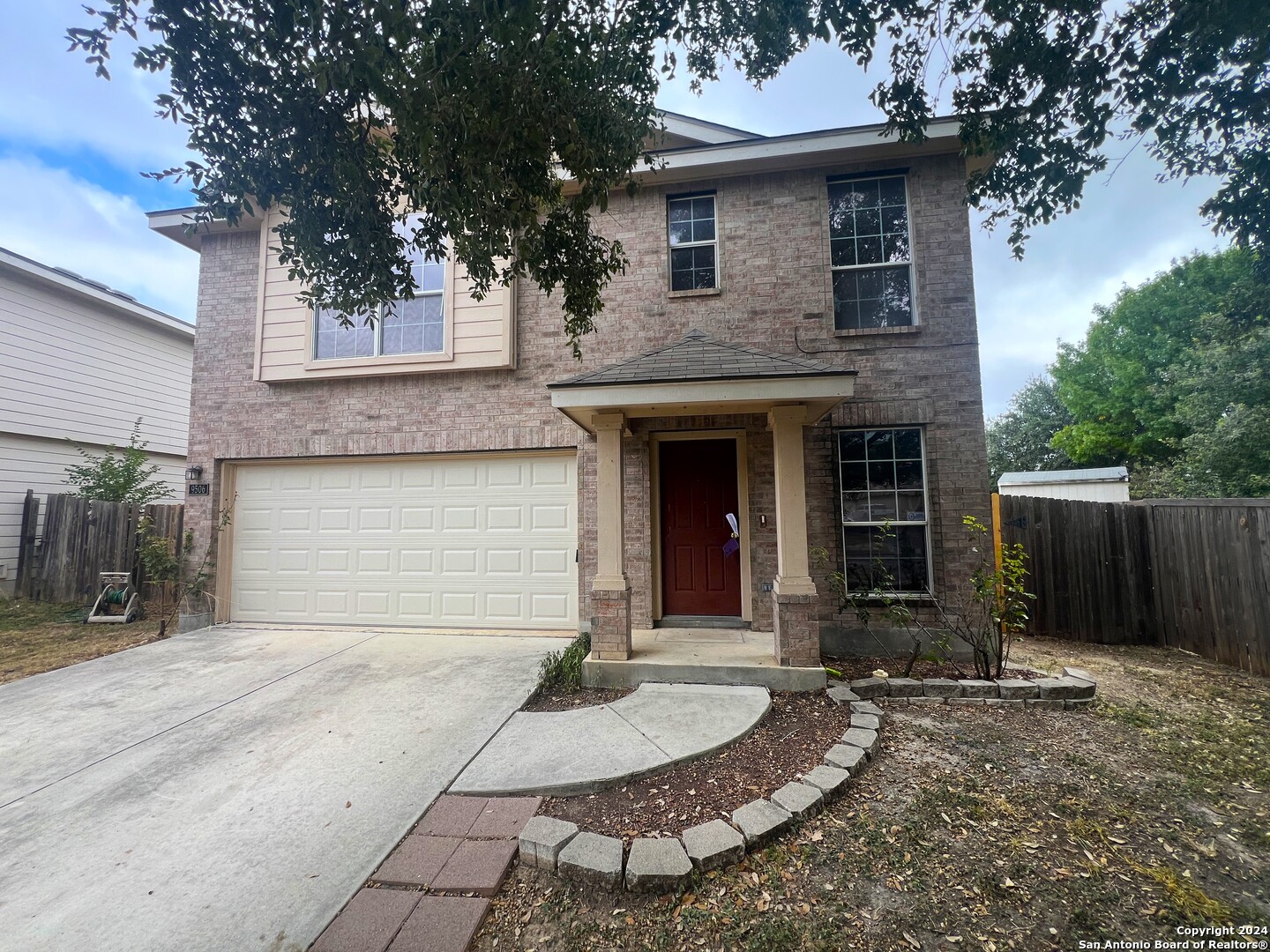 a front view of a house with garage