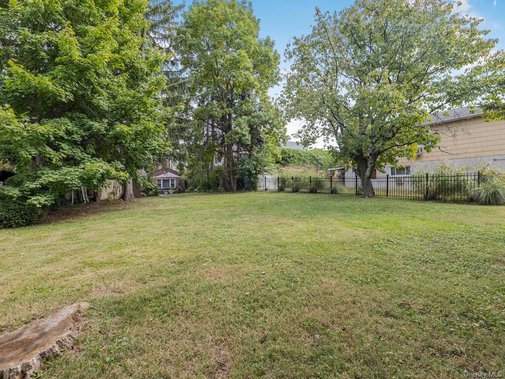 a view of a yard with a trees