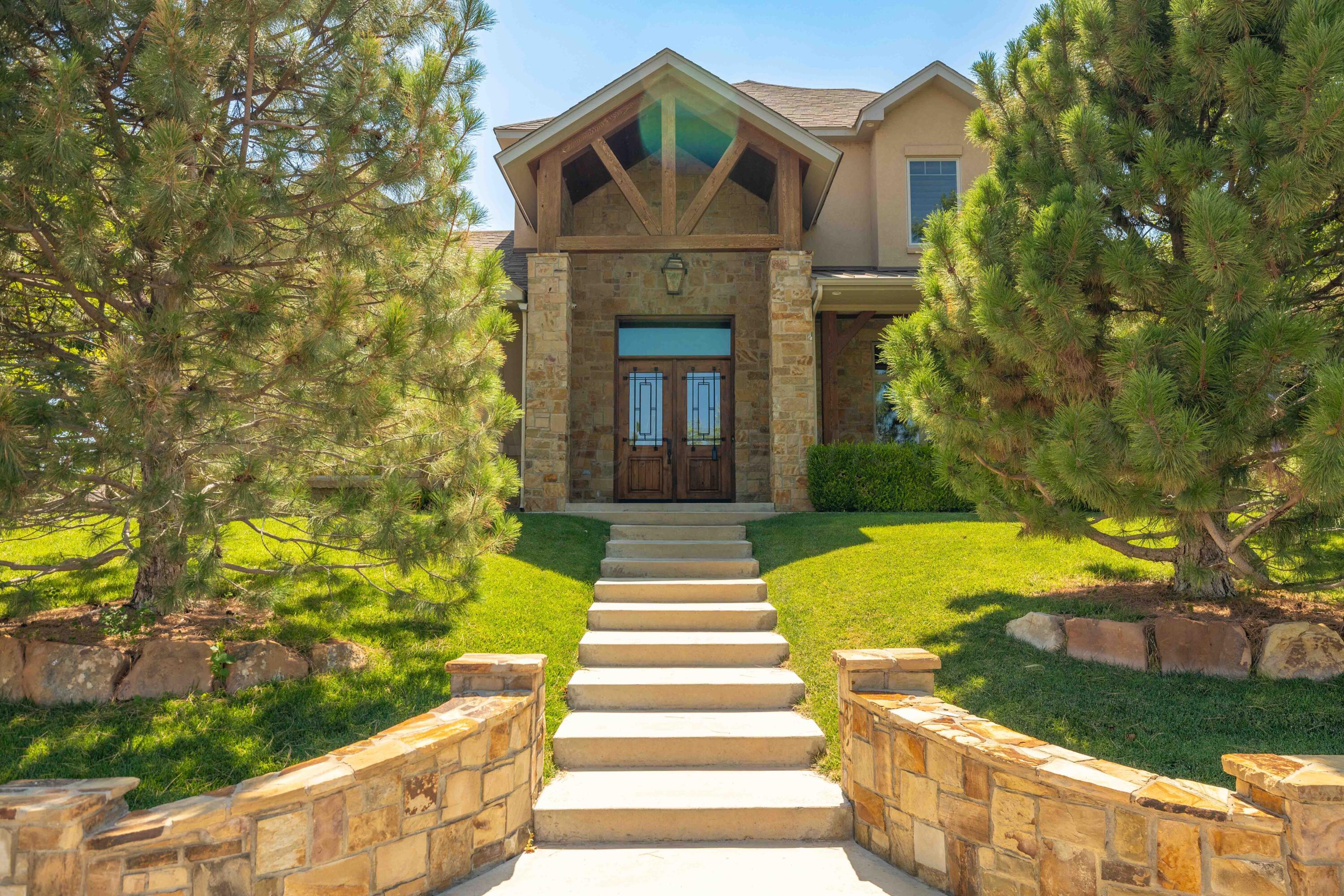 a front view of a house with garden