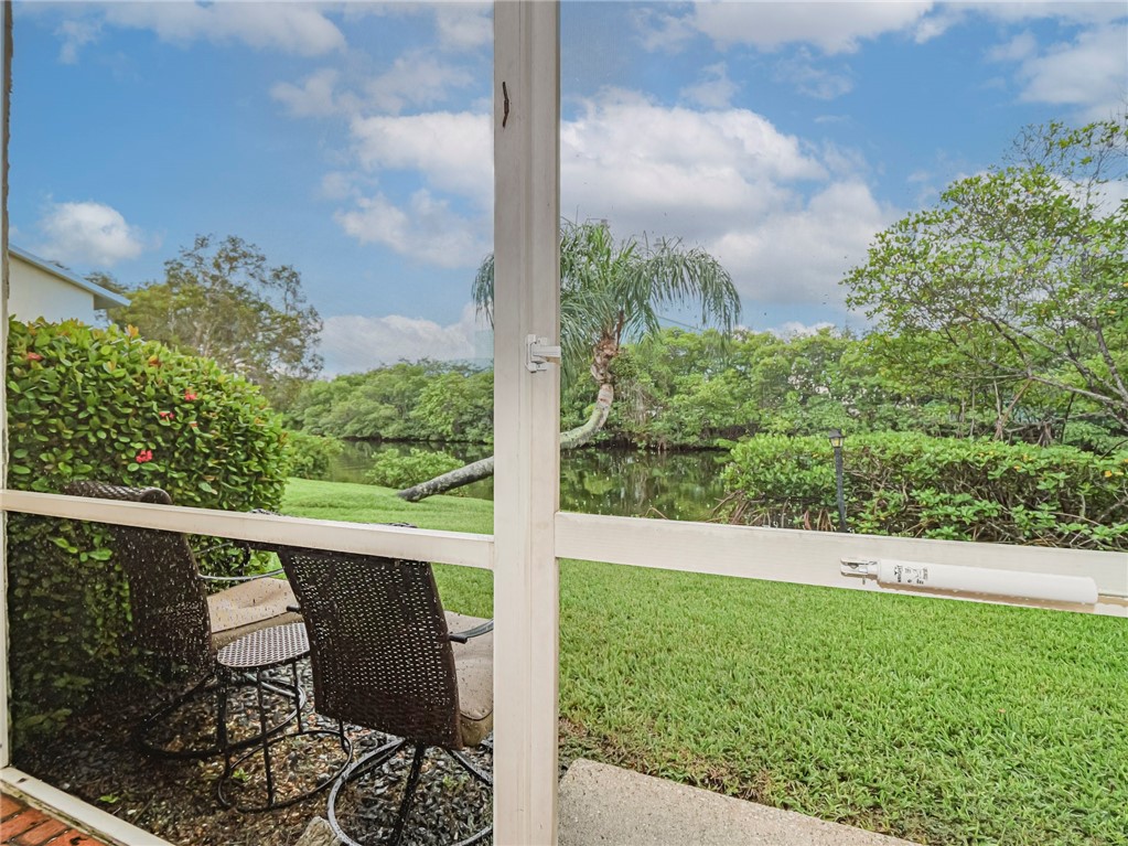 a view of balcony with wooden floor