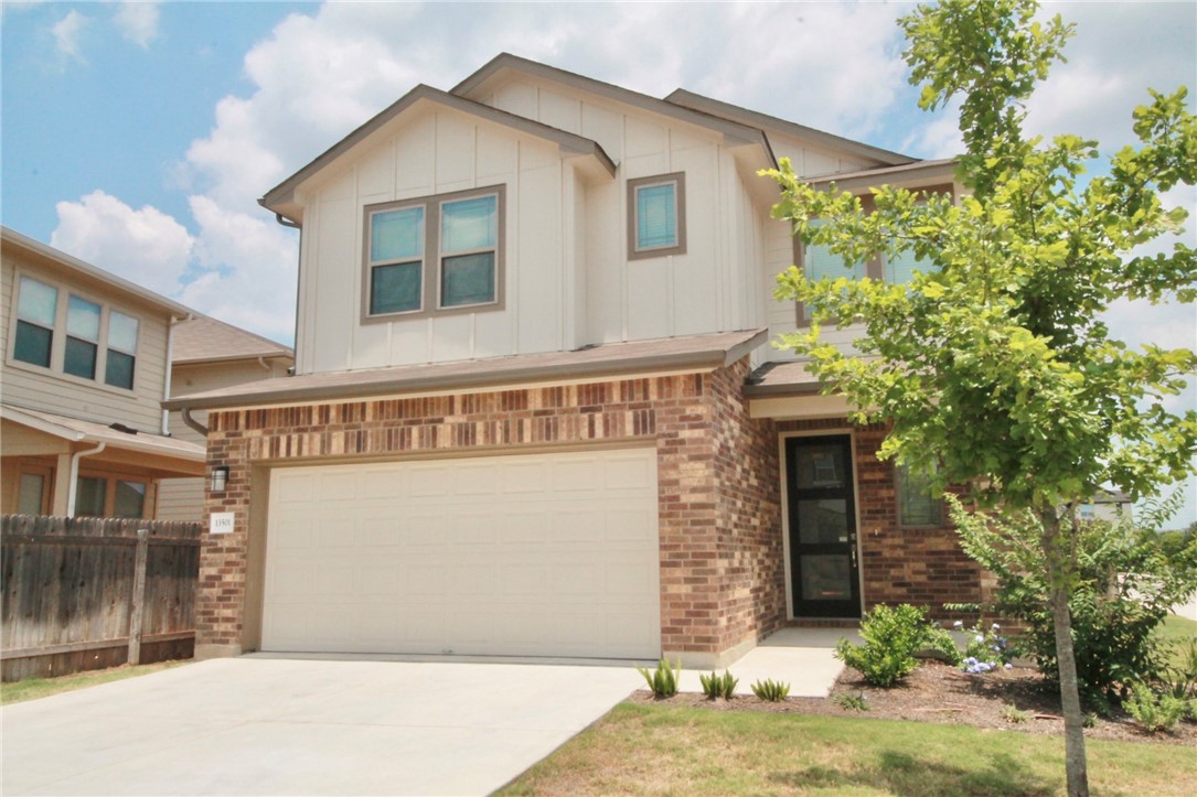 a front view of a house with a garage