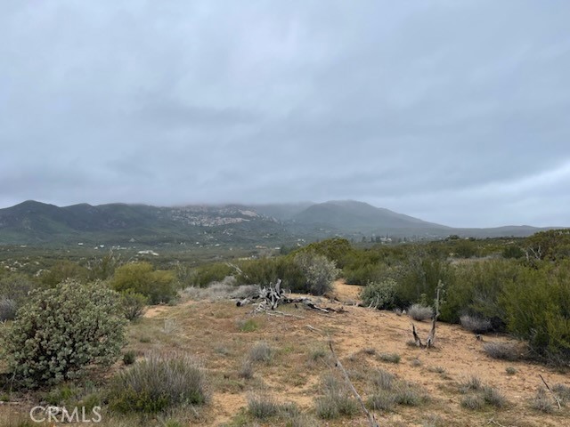 a view of a town with mountains in the background