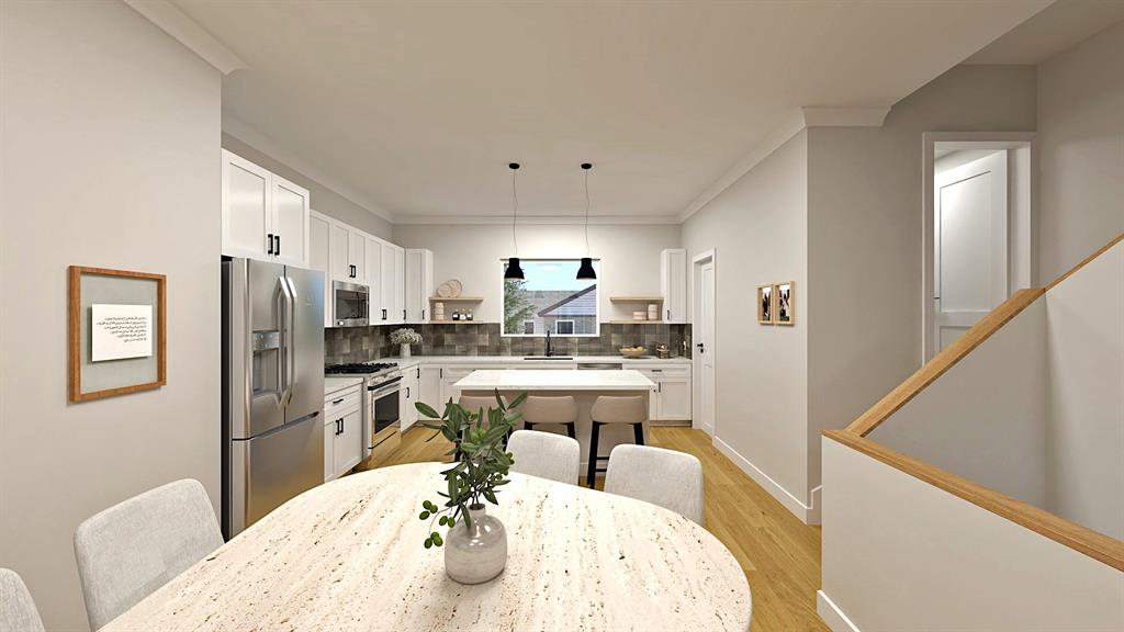 a very nice looking dining room with a large window