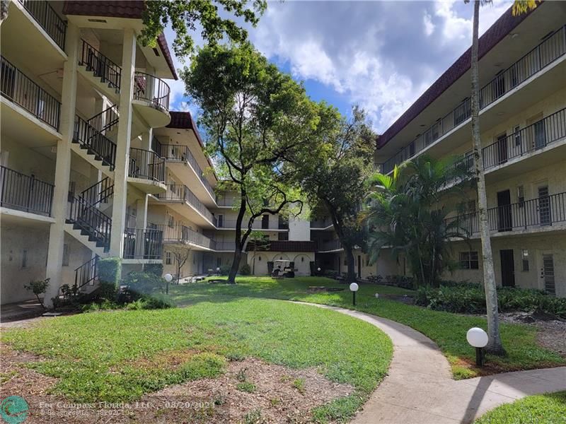 front view of a building with garden