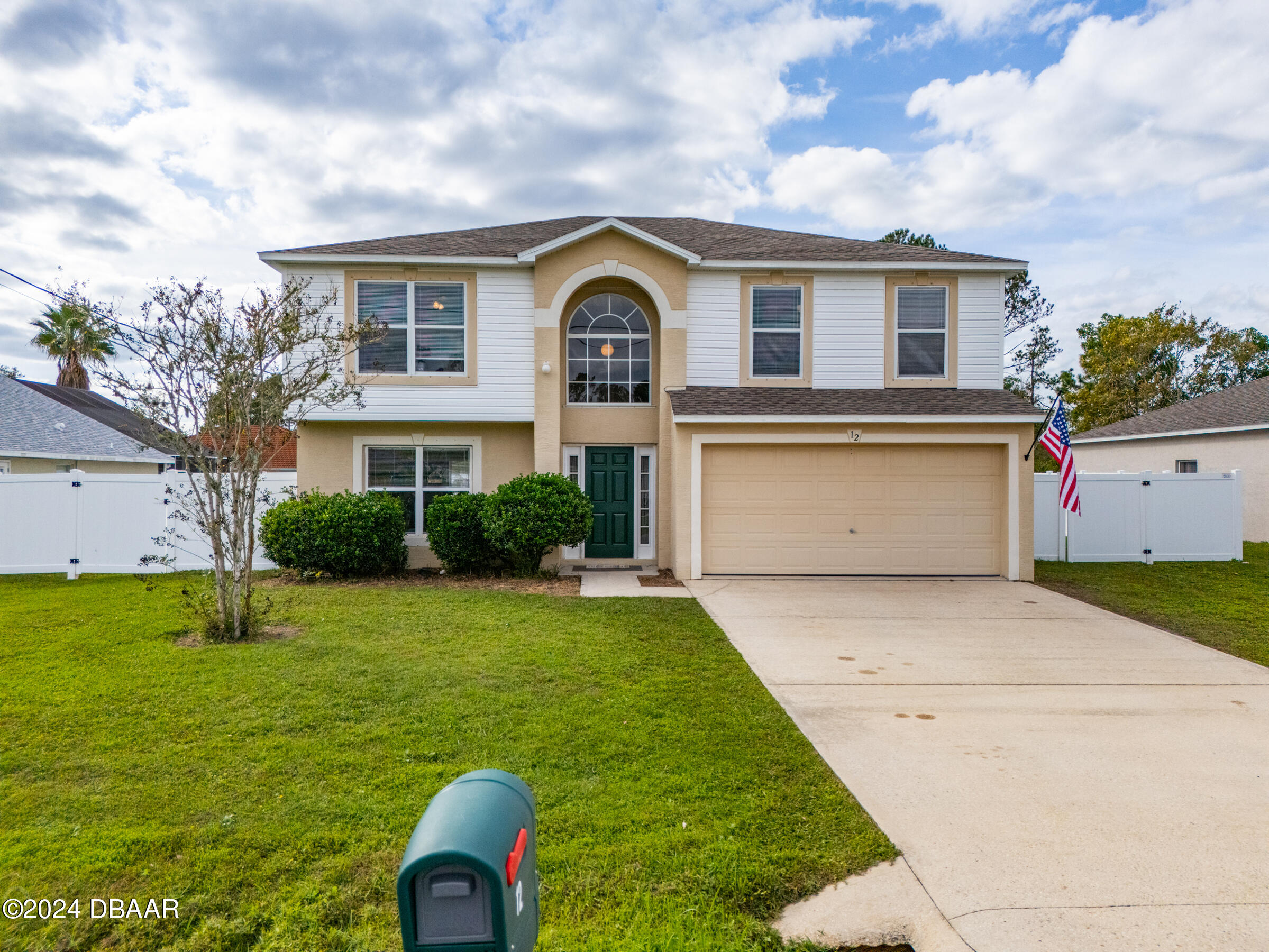 a front view of house with yard