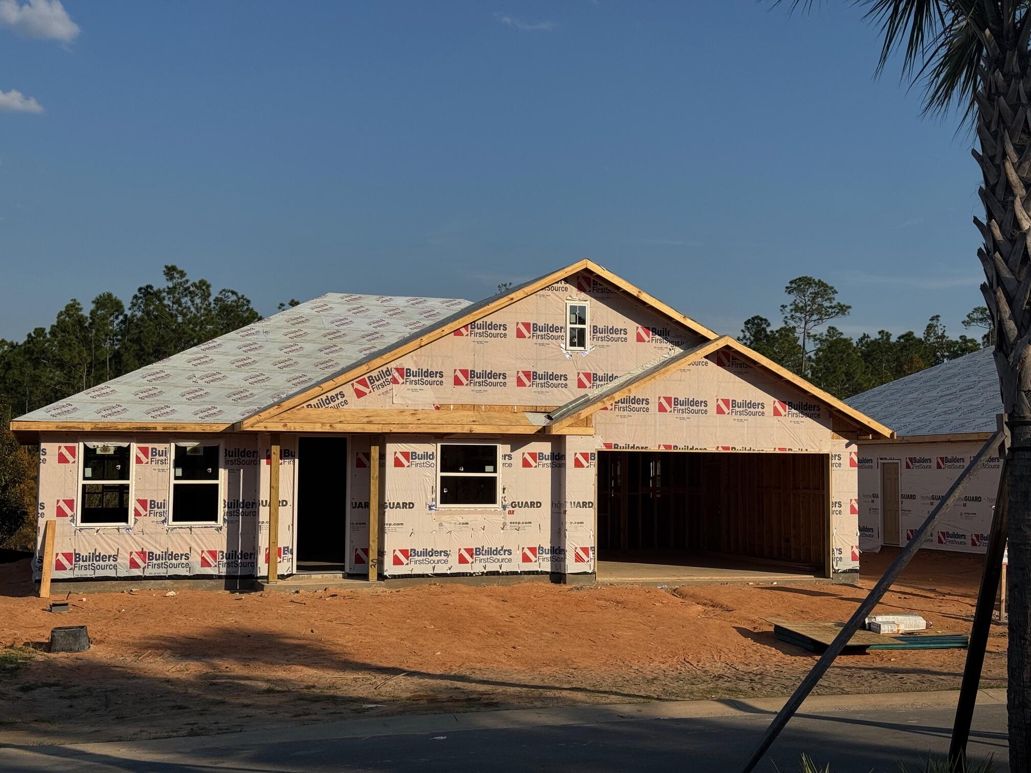 a front view of a house with garage