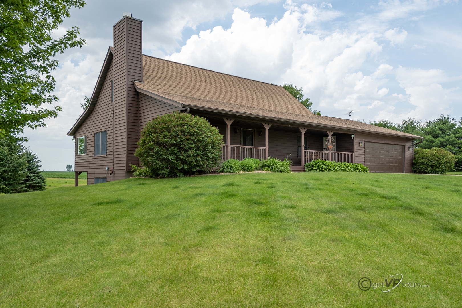 a view of a house with yard and front view of a house