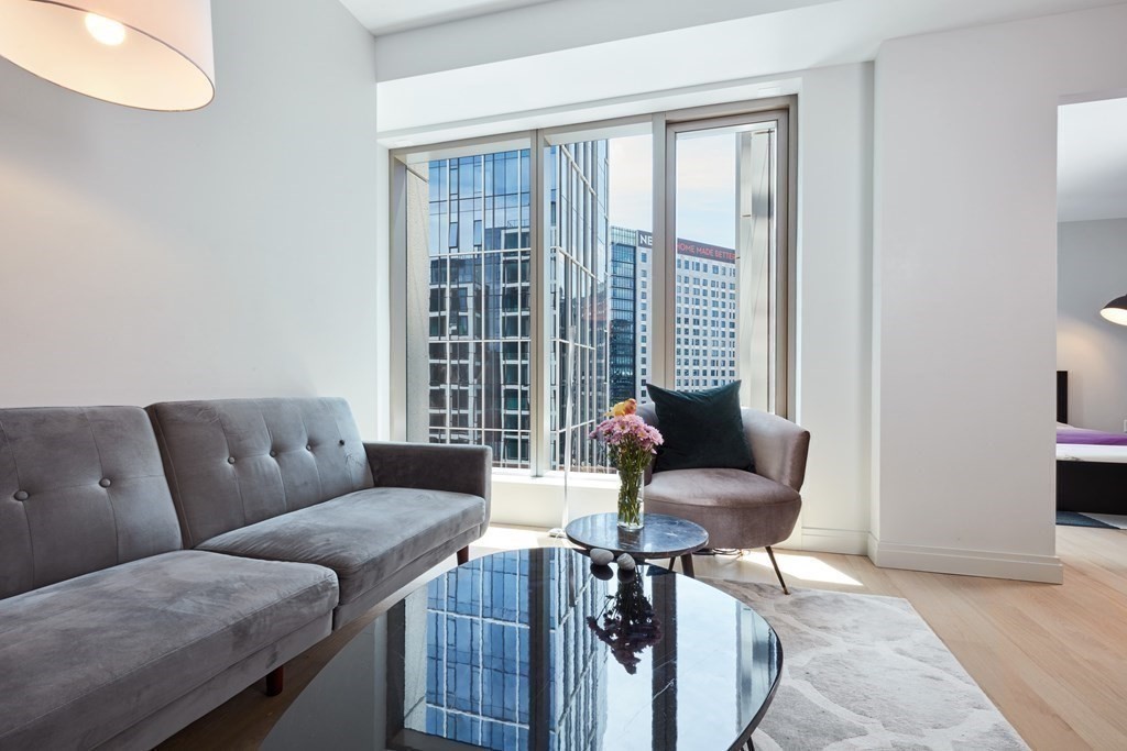 a living room with furniture and a window