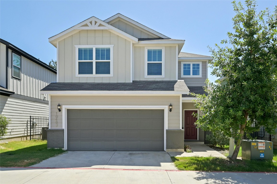 a front view of a house with a garage