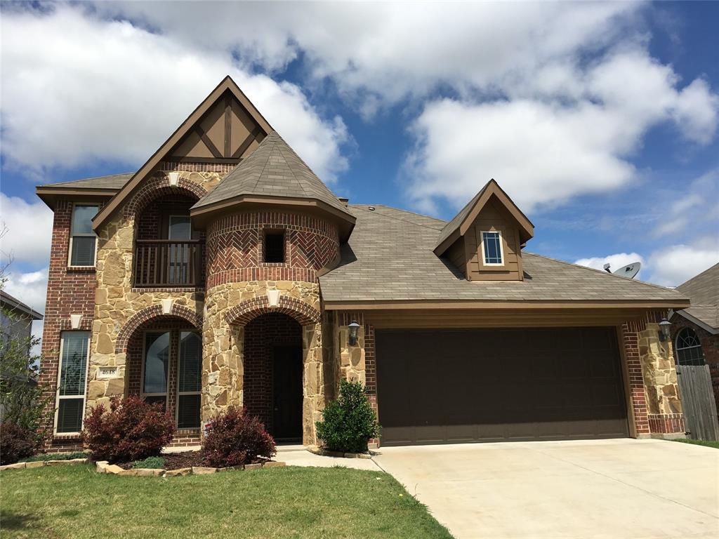 a front view of a house with yard