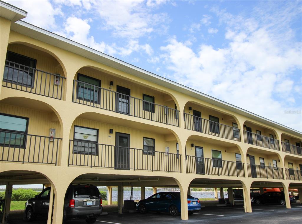 a front view of a residential apartment building with a yard