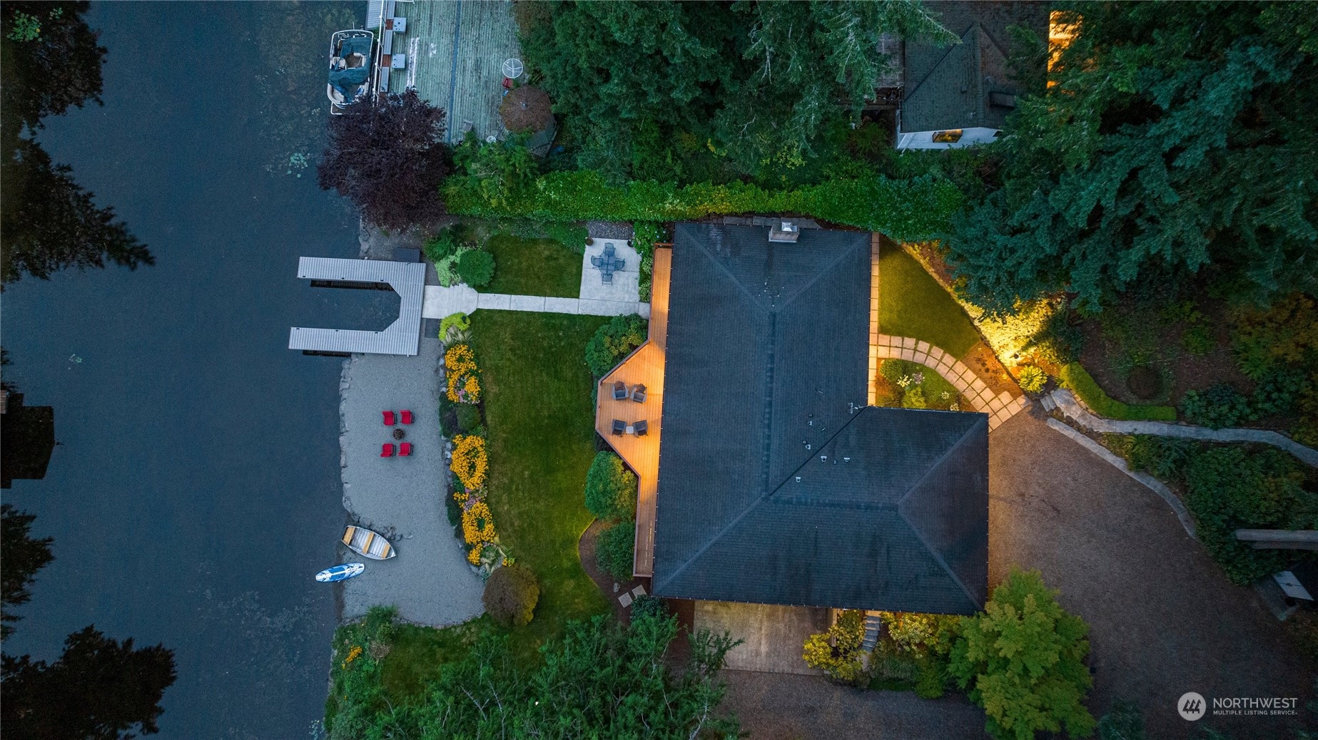 an aerial view of a house with a yard and garden