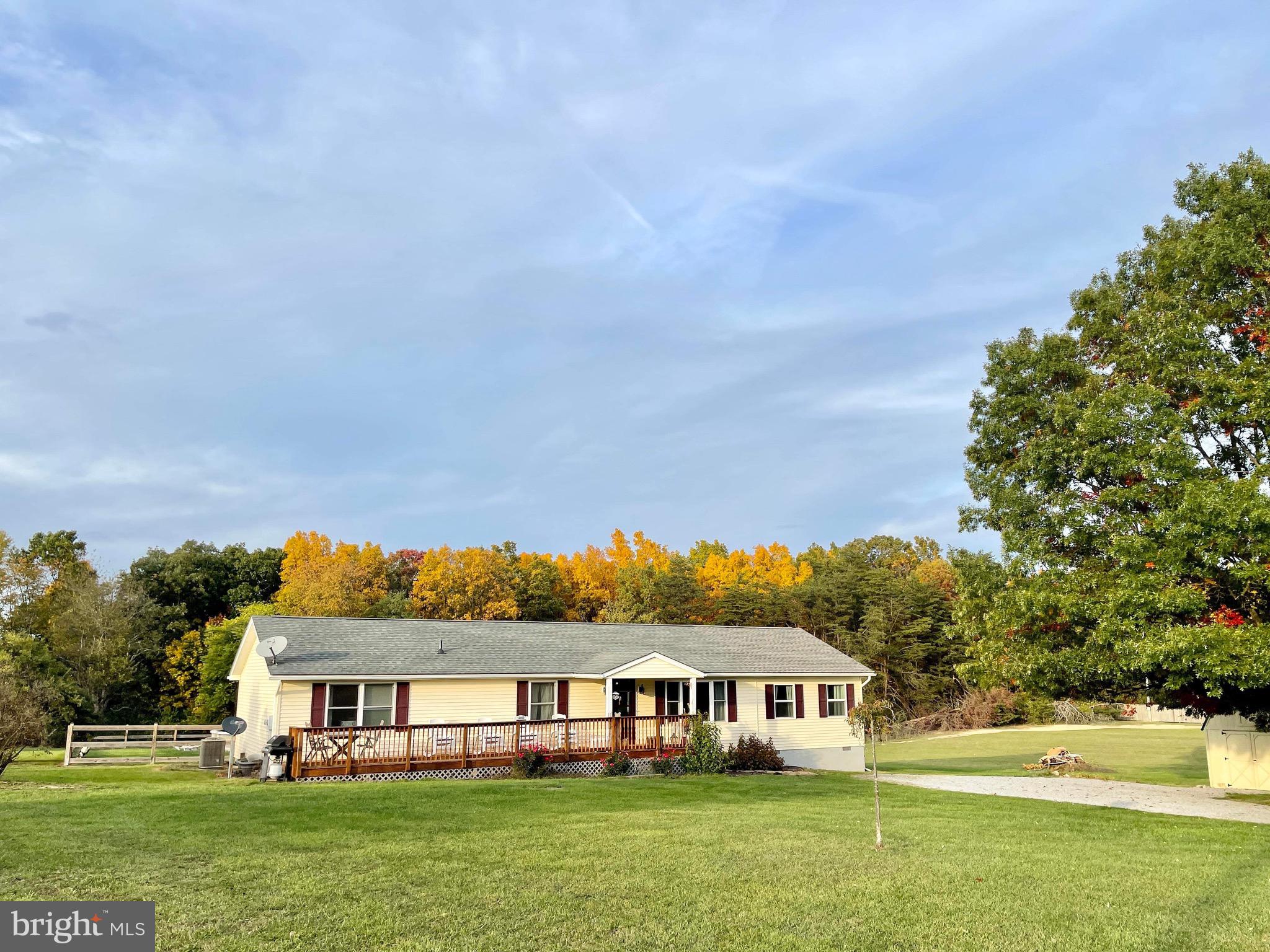 a view of house with outdoor space and swimming pool