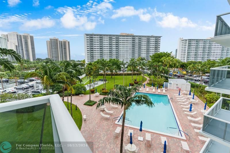 a view of a swimming pool with a patio