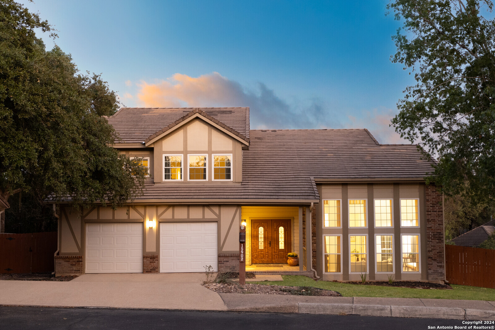 a front view of a house with a yard