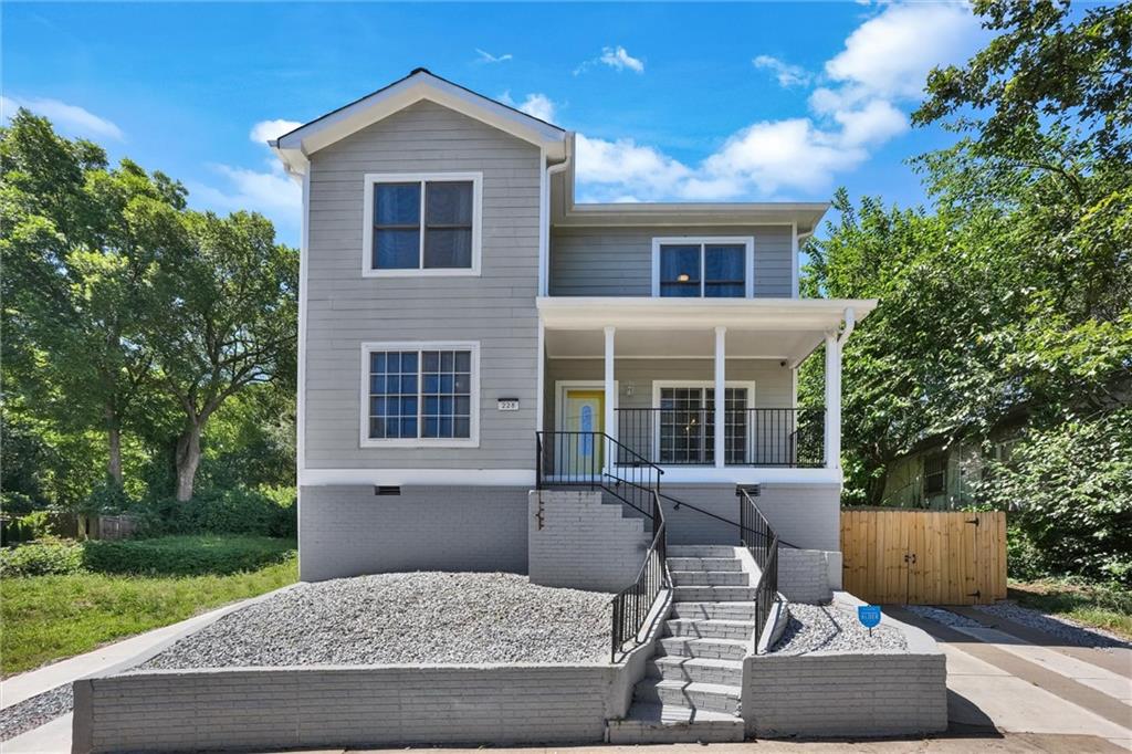 a front view of house with yard and seating area