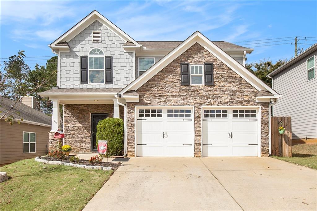 front view of a house with a yard