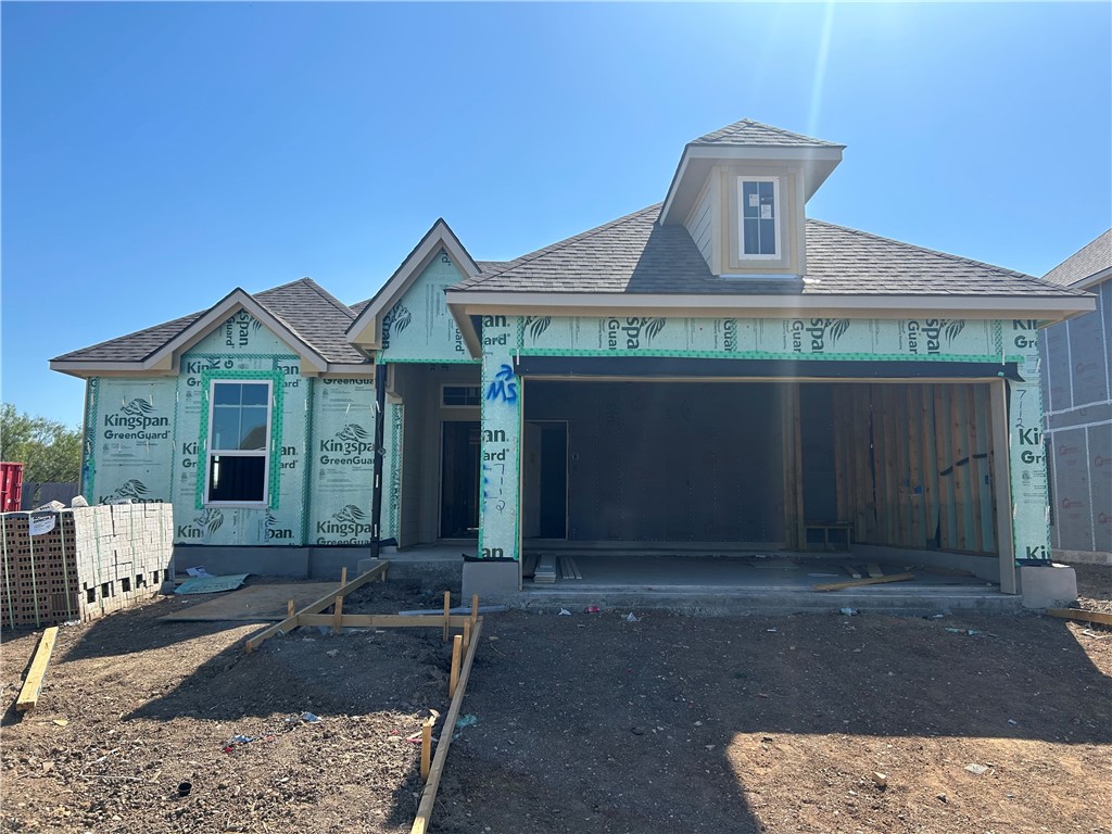 a front view of a house with yard