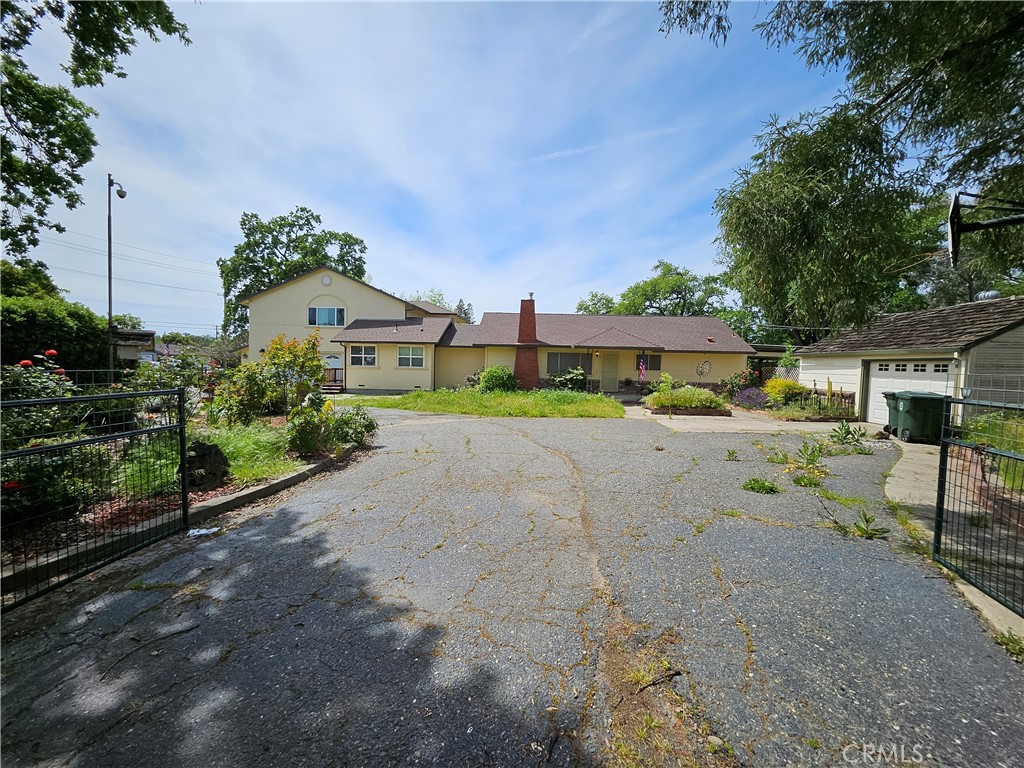 a view of house with outdoor space and street view