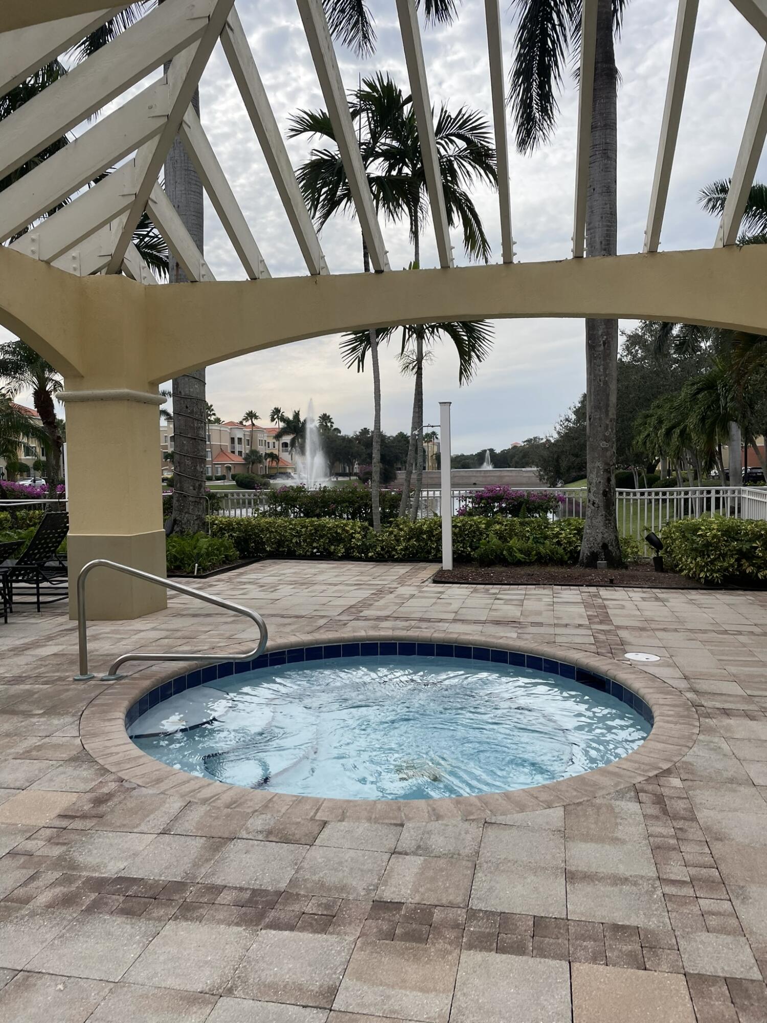 a view of a swimming pool with a patio