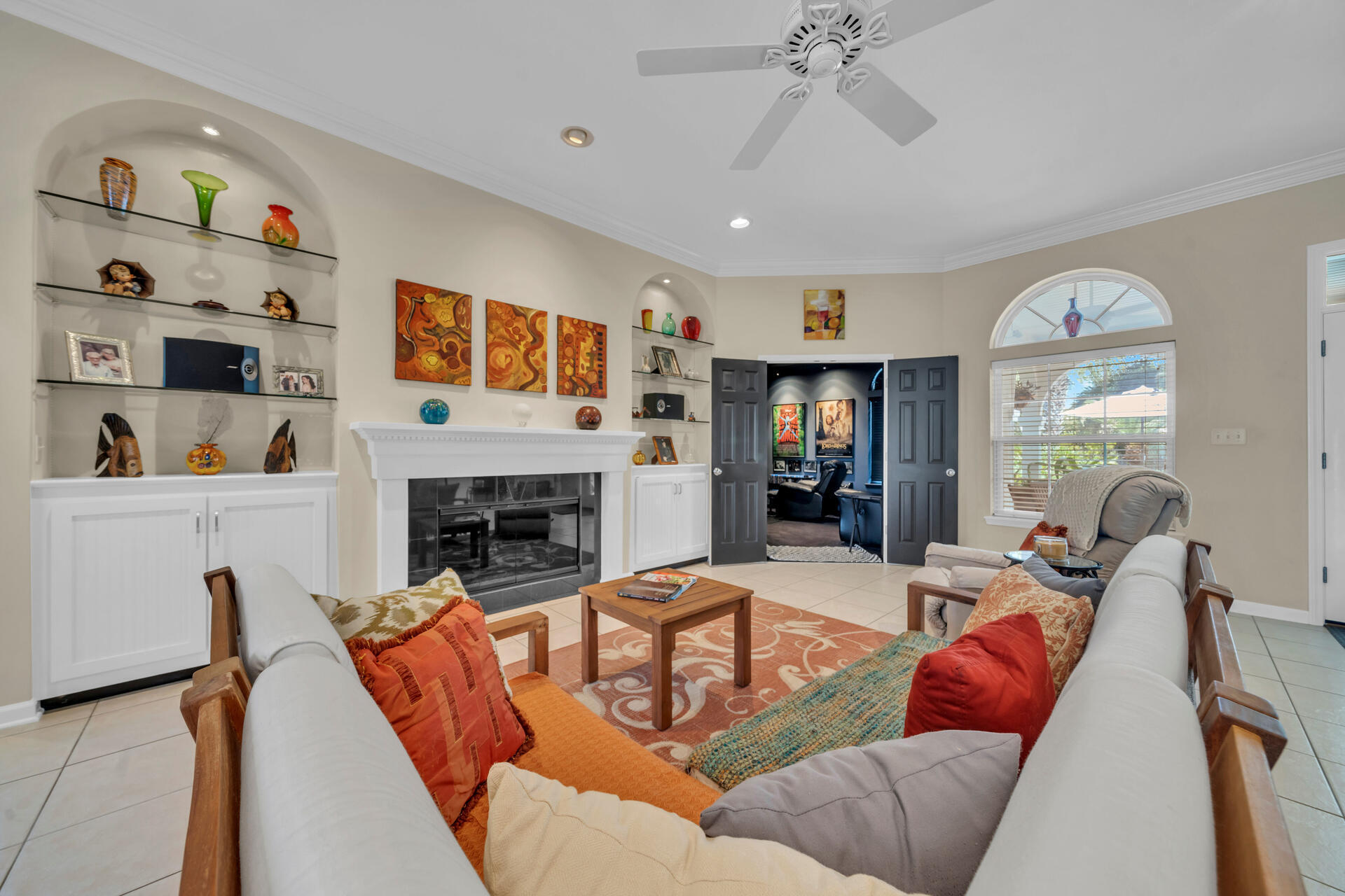 a living room with furniture fireplace and window