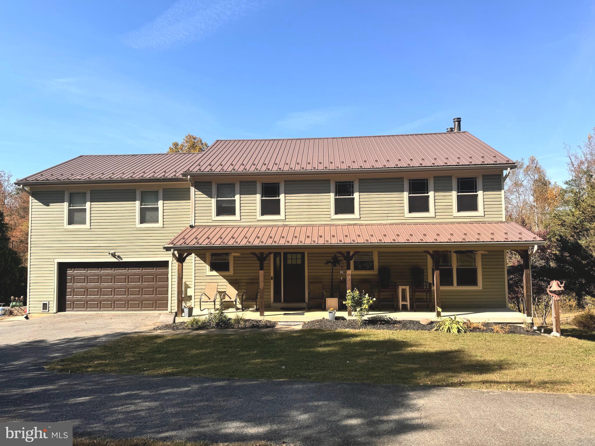 a front view of a house with swimming pool