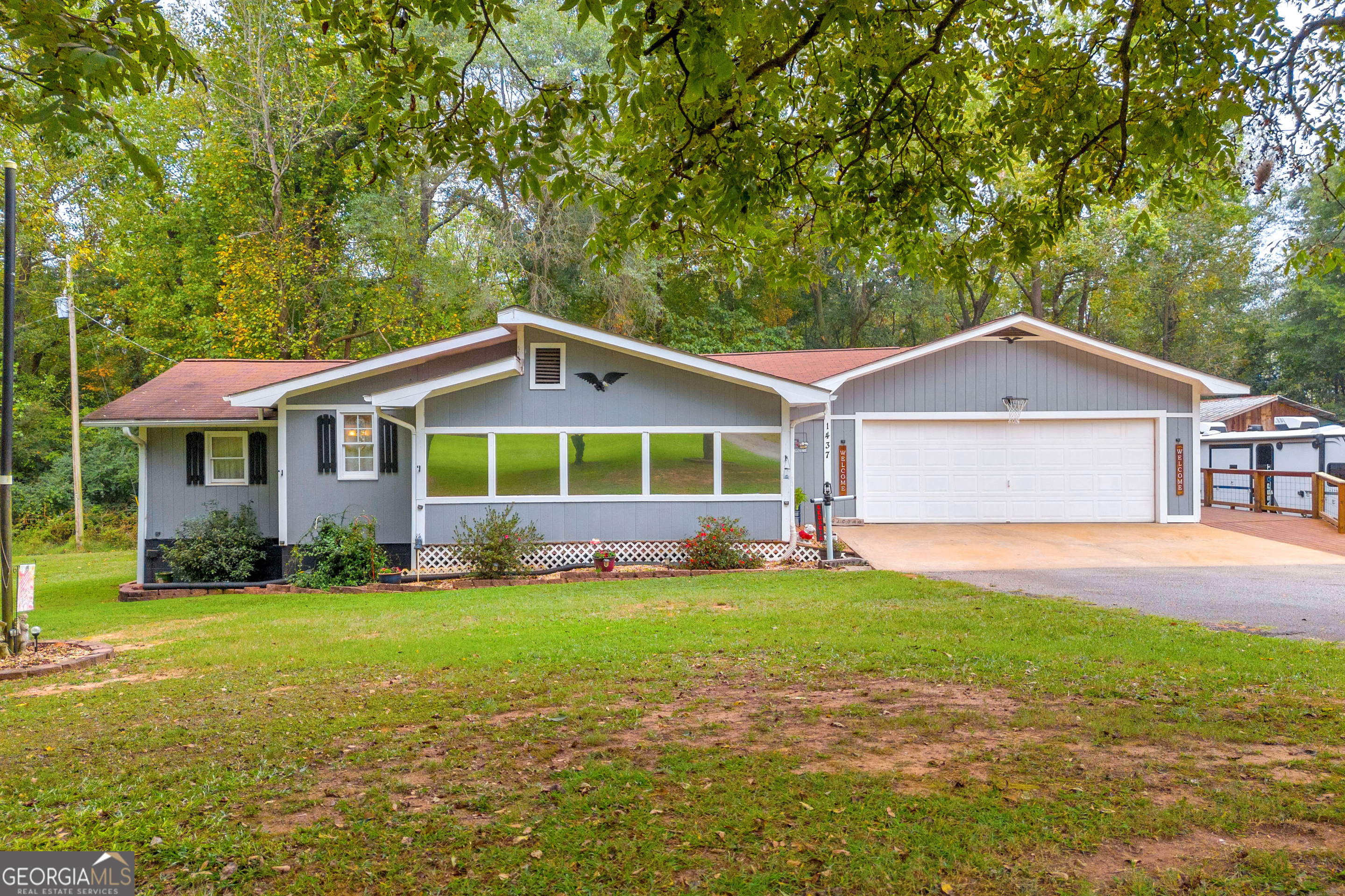 a front view of a house with a yard and porch