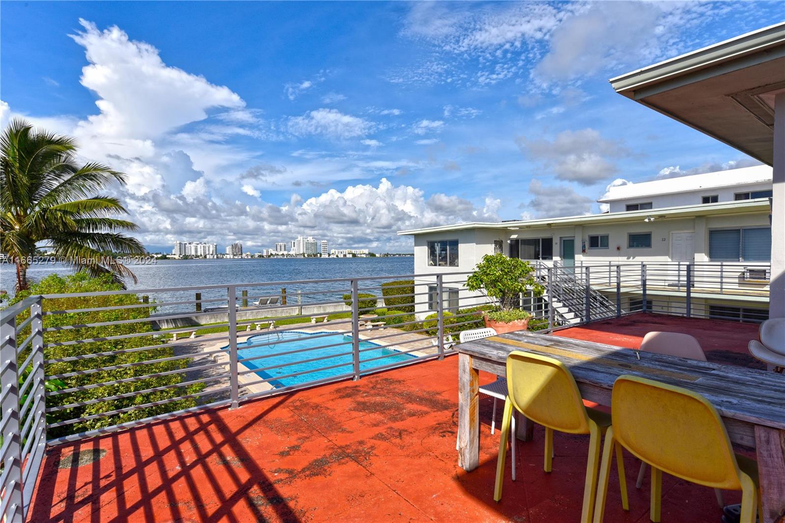 a view of a swimming pool with a lounge chairs