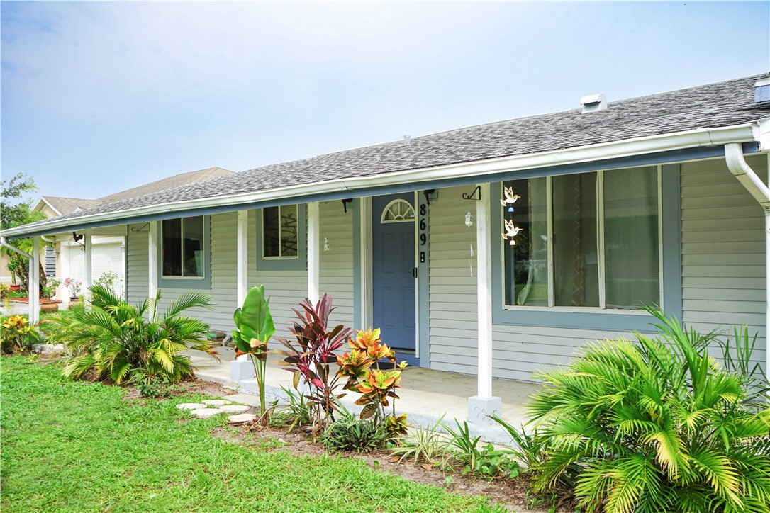 front view of a house with a yard