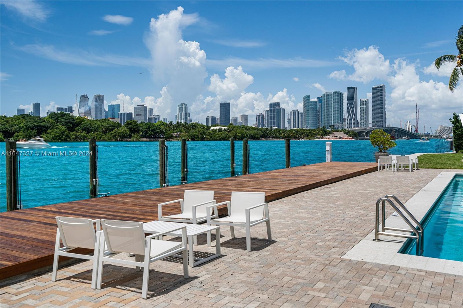 a view of a patio with a table and chairs