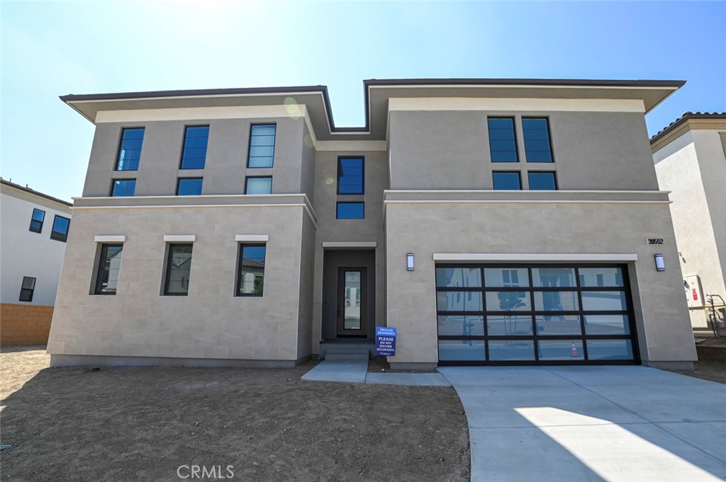 a front view of a house with a garage