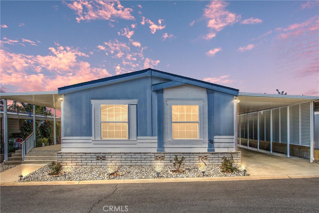 a view of house with backyard porch and entertaining space