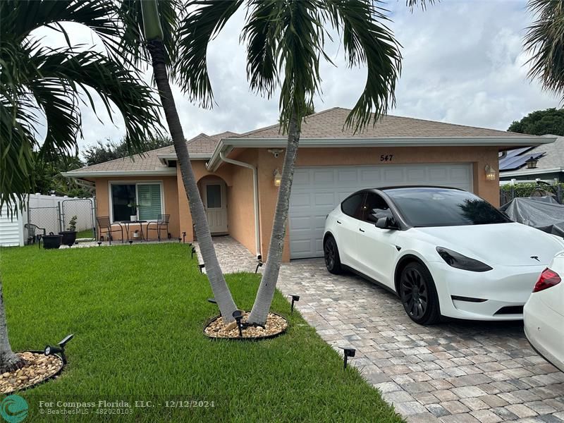 a view of a car parked in the yard