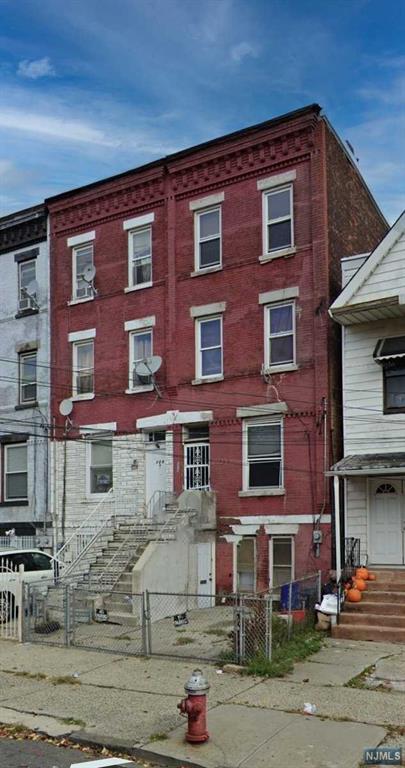 a front view of a building with street view