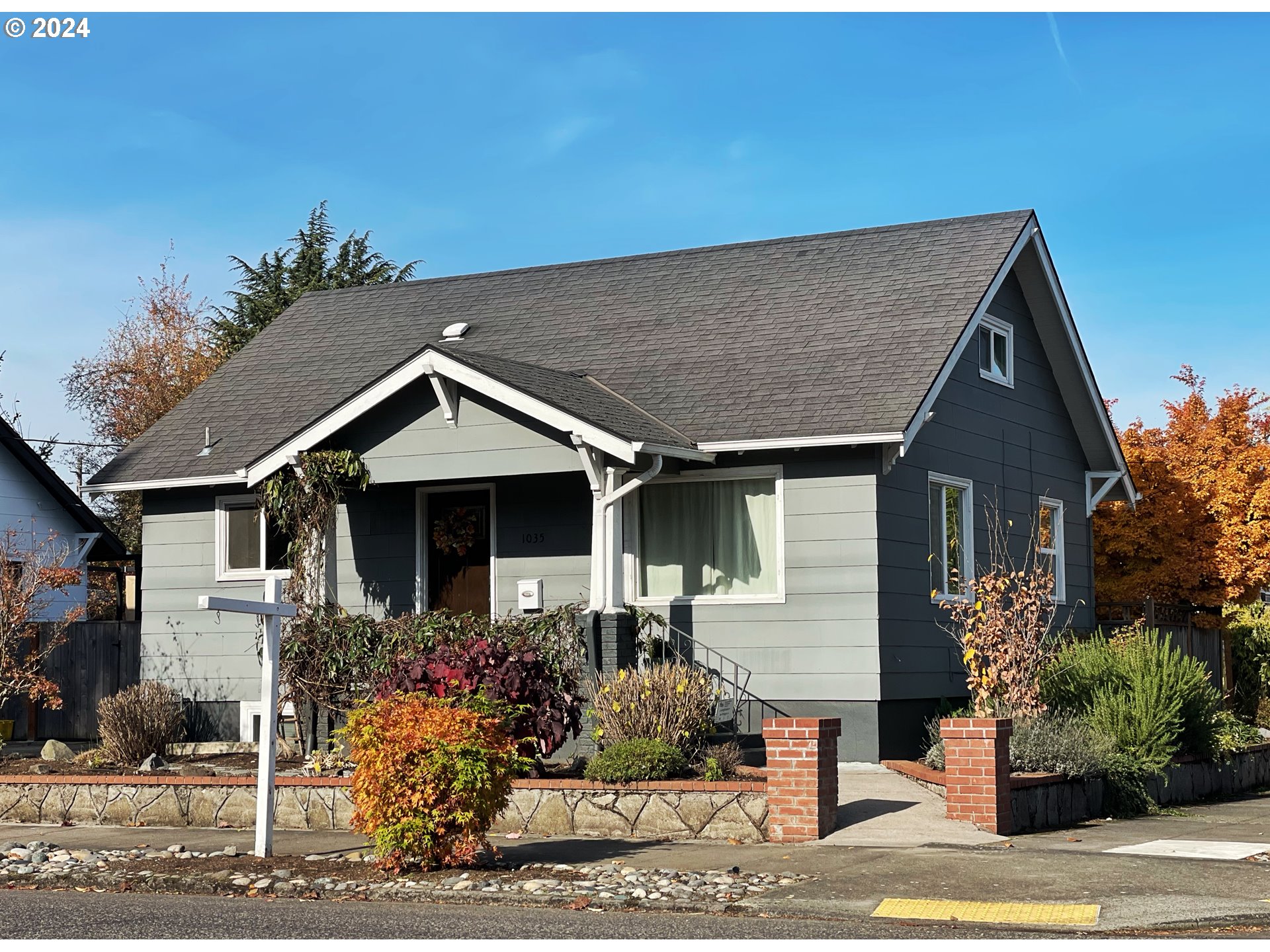 a front view of a house with garden