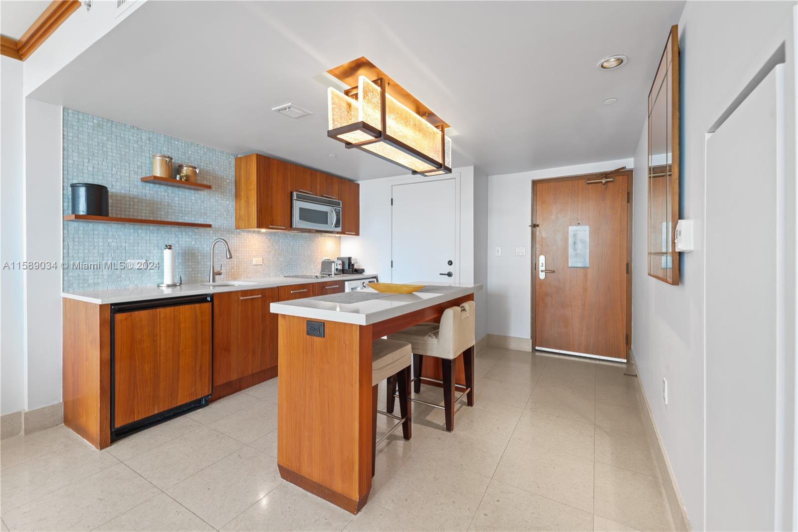 a spacious bathroom with a granite countertop sink and a mirror