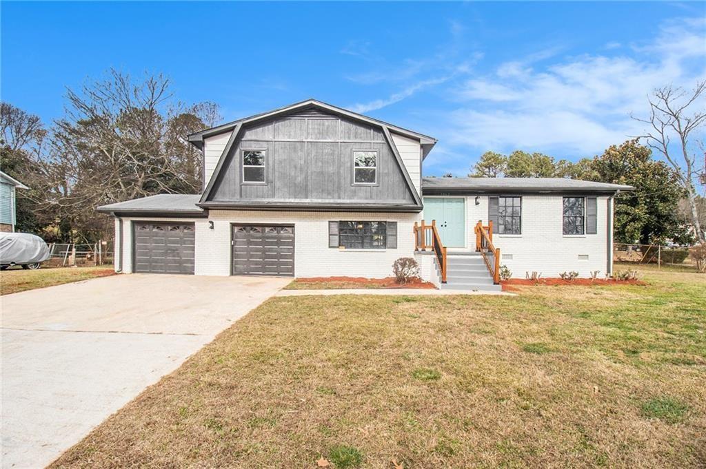 front view of a house with a yard