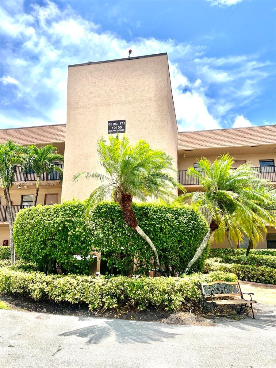 a view of a street with a building in the background