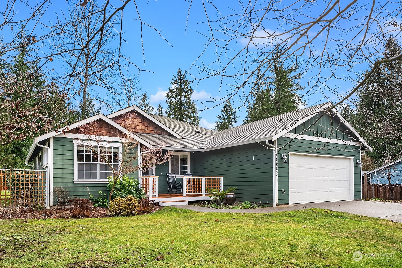 a front view of a house with a yard and porch