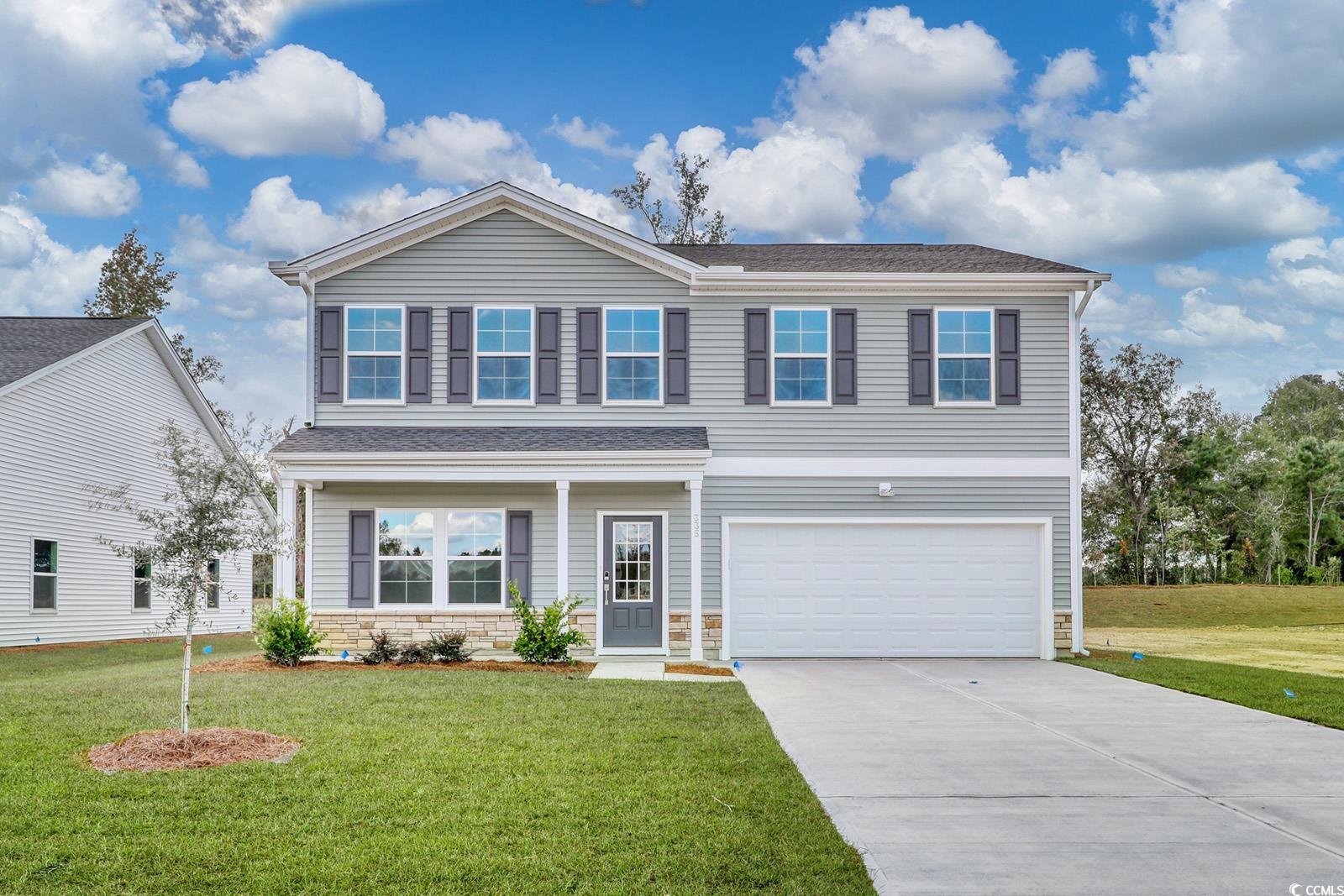 View of front of property with a front yard and a