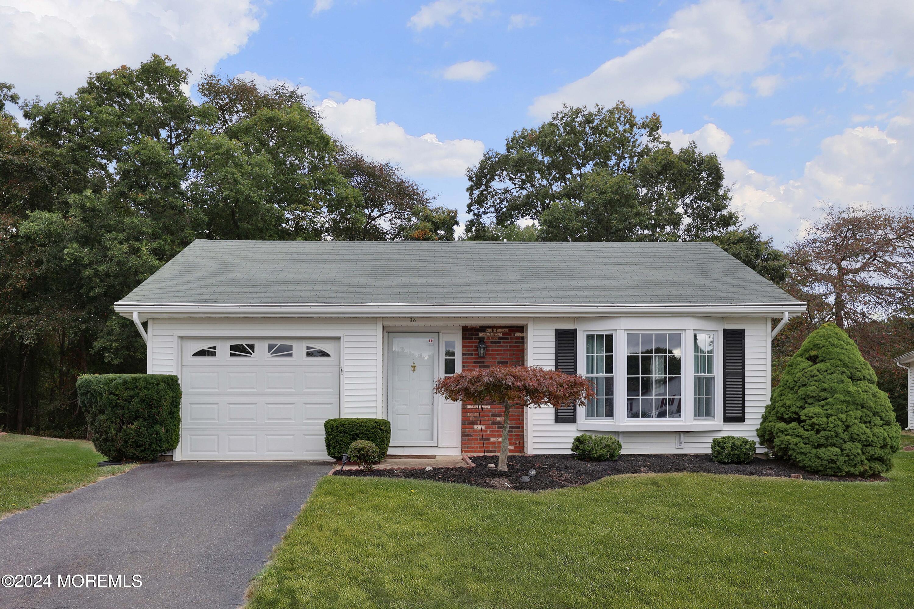 front view of a house with a yard