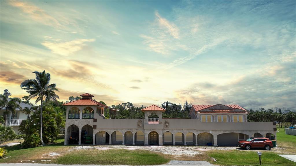 a front view of building with yard and entertaining space