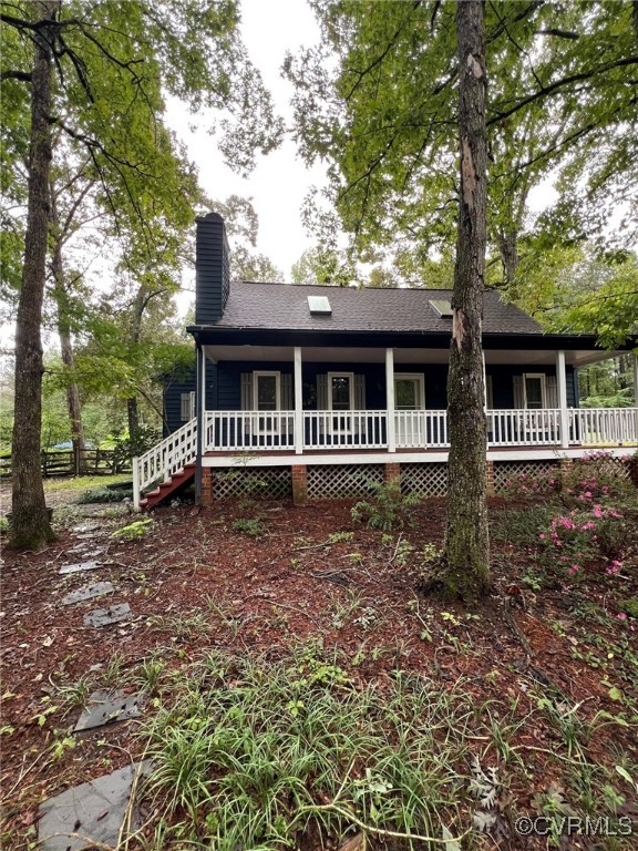 Back of property with covered porch