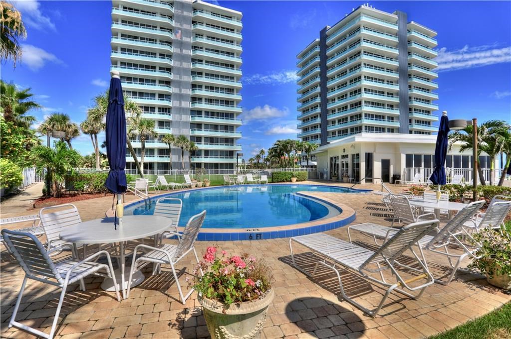 a view of a swimming pool with a patio