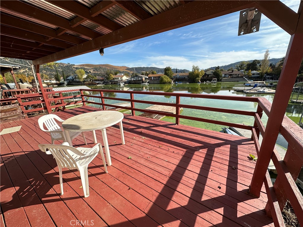 a view of a chairs and table in the balcony